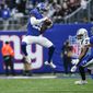 New York Giants free safety Xavier McKinney (29) intercepts a pass intended for Las Vegas Raiders&#39; Zay Jones (7) as Giants&#39; James Bradberry (24) watches during the second half of an NFL football game Sunday, Nov. 7, 2021, in East Rutherford, N.J. (AP Photo/John Munson)