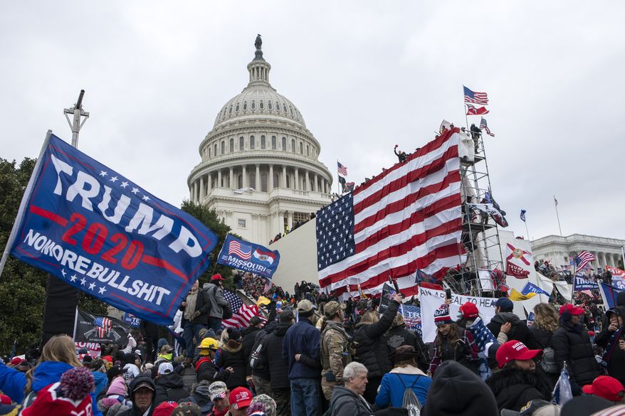 Supporters of President Donald Trump rally outside the U.S. Capitol on Wednesday, Jan. 6, 2021, in Washington. (AP Photo/Jose Luis Magana)