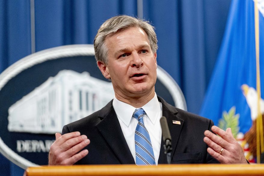 FBI Director Christopher Wray speaks at a news conference at the Justice Department in Washington, Monday, Nov. 8, 2021. Two Republican congressmen are demanding that FBI Director Christopher Wray provide details on efforts to rein in the bureau&#39;s use of warrants to spy on Americans that are approved by a secretive federal court. (AP Photo/Andrew Harnik)