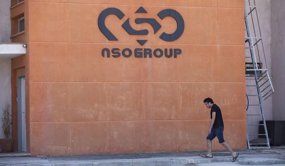 A logo adorns a wall on a branch of the Israeli NSO Group company, near the southern Israeli town of Sapir, Aug. 24, 2021. (AP Photo/Sebastian Scheiner, File)