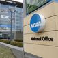 The NCAA headquarters in Indianapolis is shown in this Thursday, March 12, 2020. The NCAA on Monday, Nov. 8, 2021, set the stage for a dramatic restructuring of college sports that will give each of its three divisions the power to govern itself. (AP Photo/Michael Conroy, File) **FILE***
