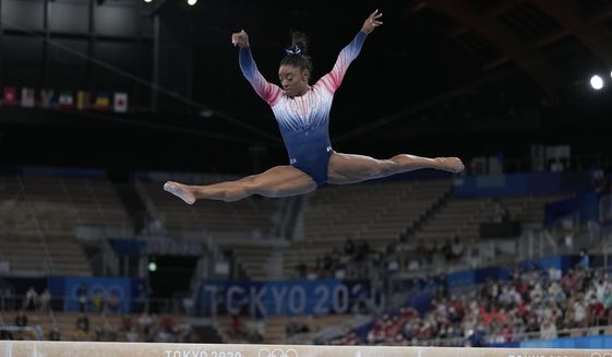 Simone Biles, of the United States, performs on the balance beam during the artistic gymnastics women&#39;s apparatus final at the 2020 Summer Olympics, Tuesday, Aug. 3, 2021, in Tokyo, Japan. Simone Biles believes the post-Olympic tour she headlined proved cathartic. It also served as a touchstone for a movement within her sport and within herself. The 24-year-old gymnastics star thinks the tour -- which will be made available to stream in December -- expanded her horizons about what&#39;s next. (AP Photo/Ashley Landis, file) **FILE**