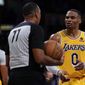 Los Angeles Lakers guard Russell Westbrook (0) disputes a call, causing a delay of game penalty during the second half of an NBA basketball game against the Charlotte Hornets in Los Angeles, Monday, Nov. 8, 2021. (AP Photo/Ashley Landis)