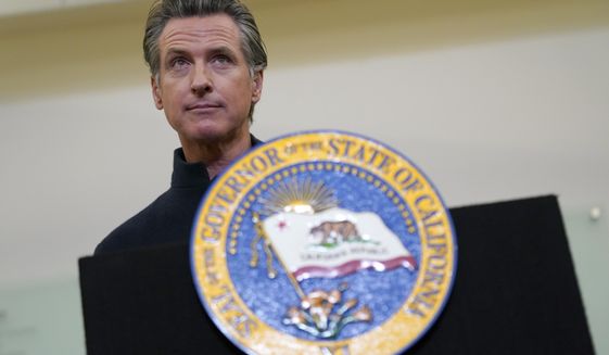 FILE - Gov. Gavin Newsom speaks at Asian Health Services in Oakland, Calif., Wednesday, Oct. 27, 2021. Newsom, who has been absent from public life in nearly two weeks after canceling his planned trip to Scotland for the United Nation&#39;s climate conference, is expected to appear at the the 2021 California Economic Summit in Monterey, Tuesday Nov. 9,2021. (AP Photo/Jeff Chiu, File)