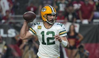 Green Bay Packers quarterback Aaron Rodgers (12) throws during the first half of an NFL football game against the Arizona Cardinals, Thursday, Oct. 28, 2021, in Glendale, Ariz. (AP Photo/Rick Scuteri) ** FILE **