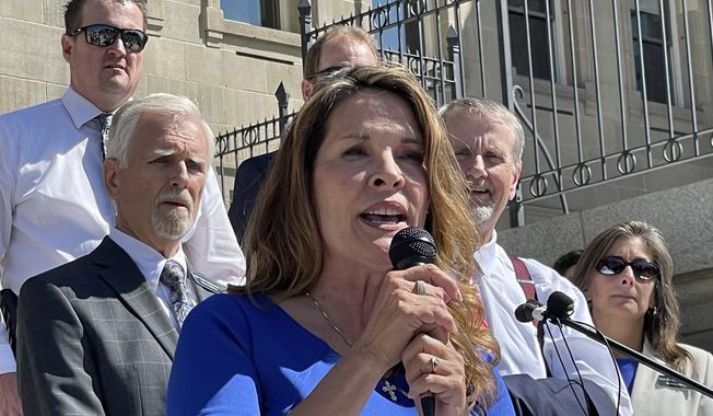 FILE - Republican Lt. Gov. Janice McGeachin addresses a rally on the Statehouse steps in Boise, Idaho, on Sept. 15, 2021. Former President Donald Trump has endorsed McGeachin over incumbent Republican Gov. Brad Little in the 2022 race for governor. Trump made the endorsement Tuesday, Nov. 9, 2021, through his political action committee following visits from Little and McGeachin last week to his Mar-a-Lago club in Palm Beach, Florida. (AP Photo/Keith Ridler, File)