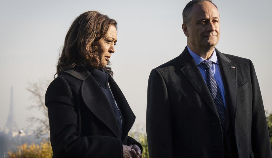 Vice President Kamala Harris and her husband Doug Emhoff, tour Suresnes American Cemetery in Suresnes, France on Wednesday, Nov. 10, 2021. (Sarahbeth Maney/The New York Times via AP, Pool)
