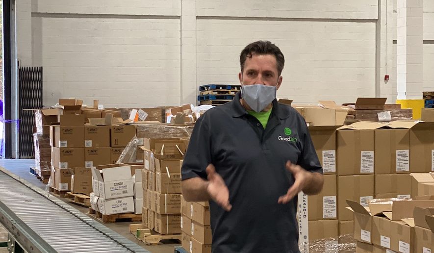 Jim Alvey, Good360’s vice president of disaster recovery and philanthropy, helps assemble &quot;comfort kits&quot; for women abuse survivors at the Capital Area Food Bank&#x27;s distribution center in Lorton, Va., on Nov. 6, 2021. (Photo courtesy of Good360)