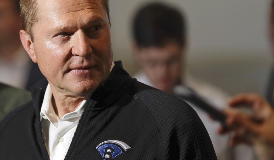 Sports agent Scott Boras, wearing a jacket with his personal logo, speaks at the Major League Baseball winter meetings in San Diego on Dec. 10, 2019. Boras, baseball’s most influential agent said the sport was the victim of a “competitive cancer” caused by teams unloading veterans to accumulate draft picks and said the Atlanta Braves’ World Series title was a direct result of tanking. (AP Photo/Gregory Bull, File) **FILE**