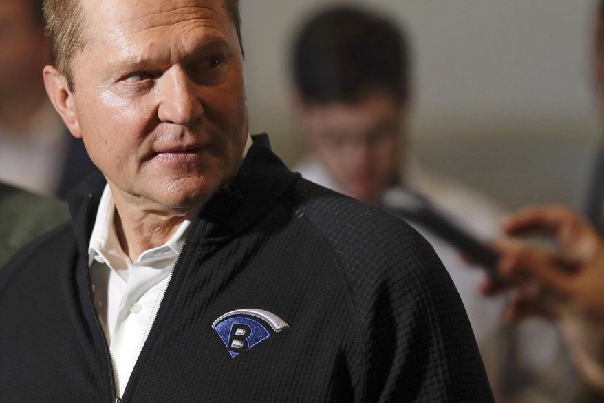 Sports agent Scott Boras, wearing a jacket with his personal logo, speaks at the Major League Baseball winter meetings in San Diego on Dec. 10, 2019. Boras, baseball’s most influential agent said the sport was the victim of a “competitive cancer” caused by teams unloading veterans to accumulate draft picks and said the Atlanta Braves’ World Series title was a direct result of tanking. (AP Photo/Gregory Bull, File) **FILE**