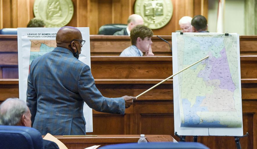 FILE - Sen. Rodger Smitherman compares U.S. Representative district maps during the special session on redistricting at the Alabama Statehouse in Montgomery, Ala., Nov. 3, 2021. (Mickey Welsh/The Montgomery Advertiser via AP, File)