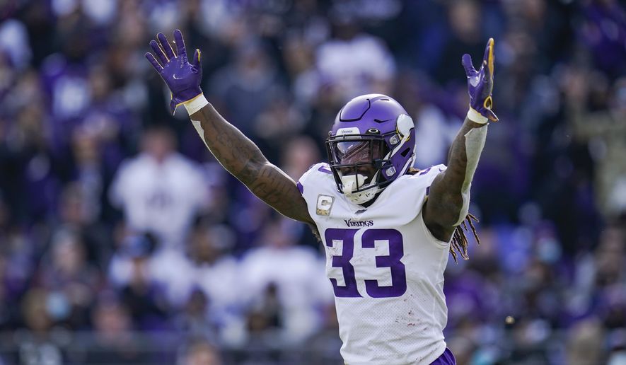 Minnesota Vikings running back Dalvin Cook celebrates a touchdown by quarterback Kirk Cousins during the first half of an NFL football game against the Baltimore Ravens, Sunday, Nov. 7, 2021, in Baltimore. (AP Photo/Julio Cortez) **FILE**