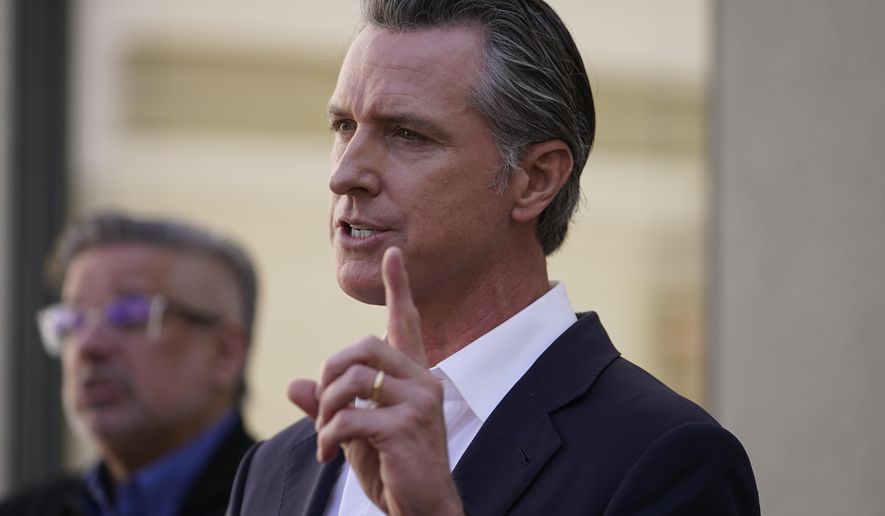 California Gov. Gavin Newsom takes questions from the media after a visit to a COVID-19 vaccine clinic at the VA Greater Los Angeles Healthcare System to promote vaccinations and booster shots in Los Angeles on Wednesday, Nov. 10, 2021. Boosters have been approved for the Pfizer, Moderna and Johnson &amp;amp; Johnson COVID-19 vaccines. (AP Photo/Damian Dovarganes)