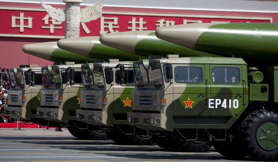 In this file photo, China&#x27;s People&#x27;s Liberation Army displays DF-26 ballistic missiles in a parade. (Associated Press/File)  **FILE**