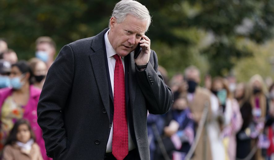 White House Chief of Staff Mark Meadows speaks on a phone on the South Lawn of the White House in Washington, on Oct. 30, 2020. The House committee investigating the Jan. 6 Capitol insurrection has issued almost three dozen subpoenas as it aggressively seeks information about the origins of the attack and what former President Donald Trump did or didn&#39;t do to stop it. The panel is exploring several paths simultaneously. (AP Photo/Patrick Semansky) ** FILE **