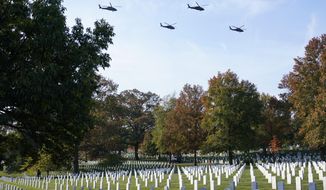 U.S. Army Blackhawk helicopters perform a flyover as part of a ceremony to commemorate the 100th anniversary of the Tomb of the Unknown Soldier at Arlington National Cemetery, Thursday, Nov. 11, 2021, in Arlington, Va. (AP Photo/Patrick Semansky)