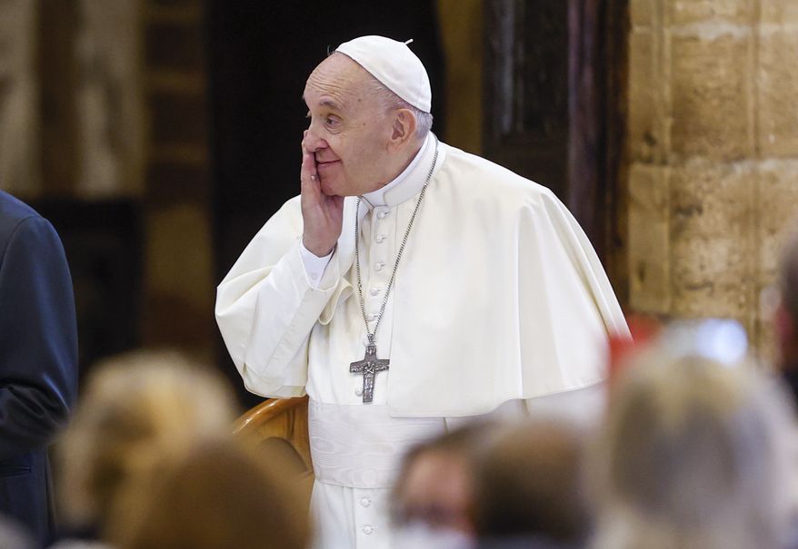 Pope Francis attends a meeting of listening and prayer inside the Basilica of Santa Maria degli Angeli in Assisi, central Italy, Friday, Nov. 12, 2021.  (AP Photo/Riccardo De Luca)