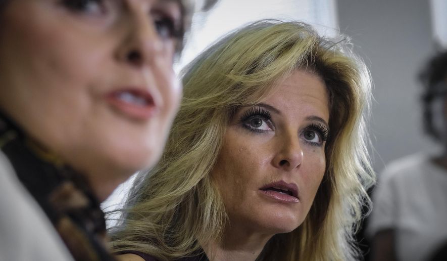 FILE - Summer Zervos, right, a former contestant on &amp;quot;The Apprentice&amp;quot; accusing Donald Trump of unwanted sexual contact, and her lawyer Gloria Allred, left, hold a news conference, Oct. 14, 2016, in Los Angeles.  On Friday, Nov. 12, 2021, Zervos dropped her defamation lawsuit against former President Trump. (AP Photo/Ringo H.W. Chiu, File)