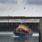 A group of people thought to be migrants are brought in to Dover, on board the Dover lifeboat, following a small boat incident in the Channel, in Kent, England, Thursday, Nov. 11, 2021. (Gareth Fuller/PA via AP)