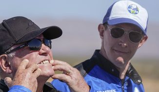 Glen de Vries, right, takes a look as William Shatner, left, shows what rocket lift-off did to his face during a media availability at the spaceport near Van Horn, Texas, Wednesday, Oct. 13, 2021. Glen de Vries, 49, and Thomas P. Fischer, 54, died in crash of a single-engine Cessna 172 that went down Thursday, Nov. 11, in a wooded area of Hampton Township, N.J. (AP Photo/LM Otero, File)