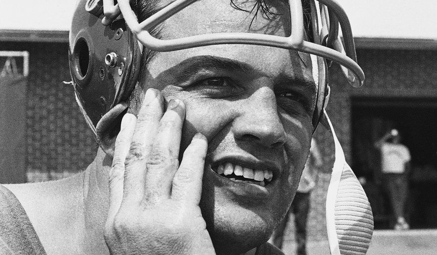 FILE - Sam Huff, the Washington Redskins middle linebacker who retired at end of 1967 season, pauses during a break in Redskins NFL football training camp in Carlisle, Pa., in July 1969, after ending his retirement. Huff, the hard-hitting Hall of Fame linebacker who helped the New York Giants reach six NFL title games from the mid-1950s to the early 1960s and later became a popular player and announcer in Washington, died Saturday, Nov. 13, 2021. He was 87. (AP Photo/Paul Vathis, File)
