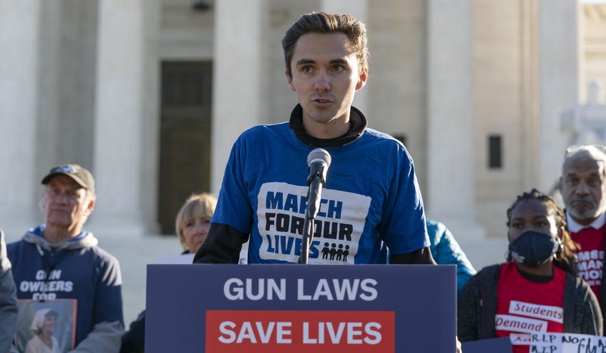 Parkland survivor and activist David Hogg speaks during a rally outside of the U.S. Supreme Court in Washington, Wednesday, Nov. 3, 2021. The Supreme Court is set to hear arguments in a gun rights case that centers on New York&#39;s restrictive gun permit law and whether limits the state has placed on carrying a gun in public violate the Second Amendment. (AP Photo/Jose Luis Magana)