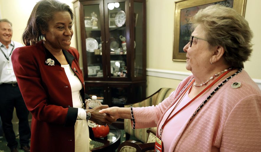 Virginia&#39;s Lt. Governor-elect Winsome Sears, left, meets with Senate Clerk Susan Schaar at the Virginia Capitol in Richmond, Va., Tuesday, Nov. 9, 2021. (AP Photo/Richmond Times-Dispatch, Alexa Welch Edlund)/Richmond Times-Dispatch via AP)