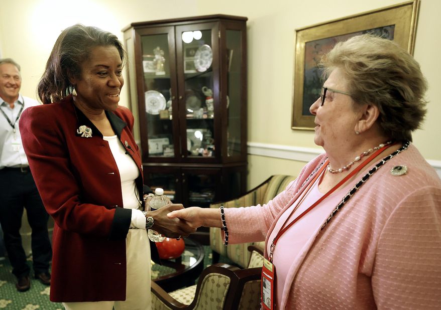 Virginia&#39;s Lt. Governor-elect Winsome Sears, left, meets with Senate Clerk Susan Schaar at the Virginia Capitol in Richmond, Va., Tuesday, Nov. 9, 2021. (AP Photo/Richmond Times-Dispatch, Alexa Welch Edlund)/Richmond Times-Dispatch via AP)