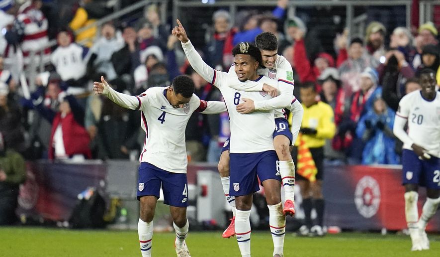 United States&#39; Weston McKennie celebrates his goal with Tyler Adams, left, and Christian Pulisic during the second half of a FIFA World Cup qualifying soccer match against Mexico, Friday, Nov. 12, 2021, in Cincinnati. The U.S. won 2-0. (AP Photo/Julio Cortez) **FILE**