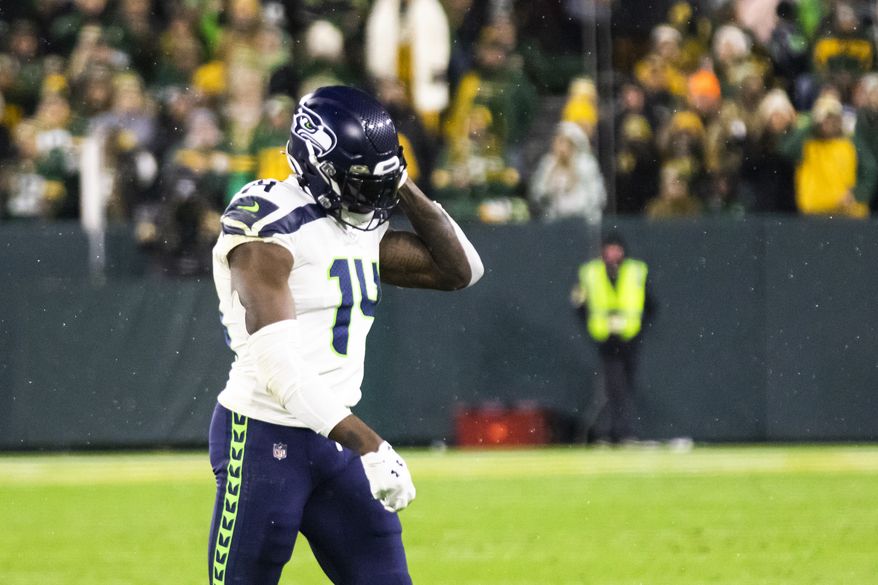 Seattle Seahawks wide receiver DK Metcalf walks off the field after being ejected in the fourth quarter during an NFL football game against the Green Bay Packers, Sunday, Nov. 14, 2021, in Green Bay, Wis. (Adam Niemi/The Daily Mining Gazette via AP)