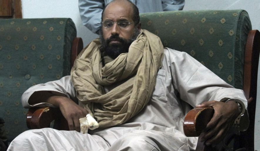 CORRECTS NAME OF TOWN TO SABHA -- FILE - Seif al-Islam is seen after his capture in the custody of revolutionary fighters in Zintan, Libya, Nov. 19, 2011. On Sunday, Nov. 14, 2021, Libya&#39;s election agency said the son and one-time heir apparent of late Libyan dictator Moammar Gadhafi has announced his candidacy for the country’s presidential elections next month. The election agency said al-Islam submitted his candidacy papers Sunday in the southern town of Sabha. (AP Photo/Ammar El-Darwish, File)