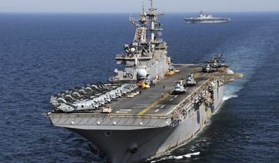 In this Wednesday, April 6, 2011 photo released by U.S. Navy, the forward-deployed amphibious assault ship USS Essex (LHD 2) steams off the coast of northeastern Japan with the Japan Maritime Self Defense Force Ship JS Hyuga (DDH 181). Essex, with the embarked 31st Marine Expeditionary Unit, is operating off the coast of Kesenuma, in northeastern Japan, in support of Operation Tomodachi. Operation Tomodachi, which incorporates the Japanese word meaning &quot;friend,&quot; is the U.S. military&#39;s humanitarian assistance program for the stricken region that started on March 13, two days after the quake and tsunami. (AP Photo/U.S. Navy, MC2 Mark R. Alvarez)