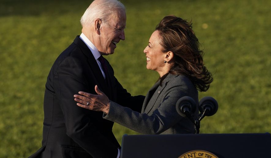 President Joe Biden embraces Vice President Kamala Harris as he speaks before signing the $1.2 trillion bipartisan infrastructure bill into law during a ceremony on the South Lawn of the White House in Washington, Monday, Nov. 15, 2021. (AP Photo/Susan Walsh)