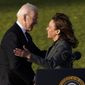 President Joe Biden embraces Vice President Kamala Harris as he speaks before signing the $1.2 trillion bipartisan infrastructure bill into law during a ceremony on the South Lawn of the White House in Washington, Monday, Nov. 15, 2021. (AP Photo/Susan Walsh)