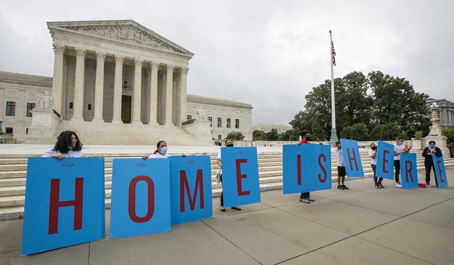In this June 18, 2020 file photo, Deferred Action for Childhood Arrivals (DACA) students gather in front of the Supreme Court in Washington. The vast majority do not support a border opening or an amnesty for the nearly 11 million immigrants living illegally in the United States, but they do support changes in immigration laws that have not been updated for decades. (AP Photo/Manuel Balce Ceneta, File)