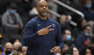 Washington Wizards coach Wes Unseld Jr. gestures during the first half of the team&#39;s NBA basketball game against the New Orleans Pelicans, Monday, Nov. 15, 2021, in Washington. (AP Photo/Nick Wass)