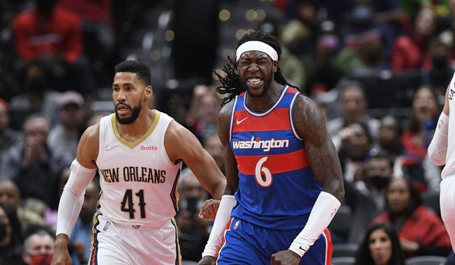 Washington Wizards center Montrezl Harrell (6) reacts next to New Orleans Pelicans forward Garrett Temple (41) during the first half of an NBA basketball game Monday, Nov. 15, 2021, in Washington. (AP Photo/Nick Wass)