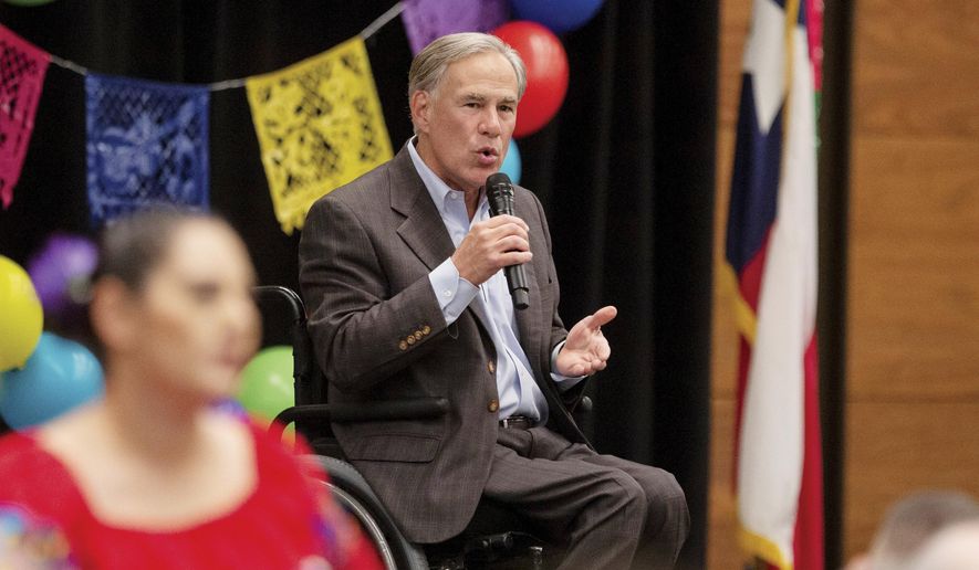 Gov. Greg Abbott speaks on a variety of matters including a border wall, razor wire, critical race theory, election laws, mail-in ballots, voter fraud, and more at the Midland Chapter of the Republican National Hispanic Assembly&#x27;s Reagan Lunch at the Bush Convention Center Friday, Nov. 5, 2021, in Midland, Texas. (Jacob Ford/Odessa American via AP) ** FILE **