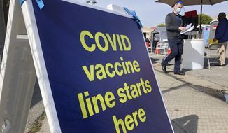 A sign is displayed at a COVID-19 vaccine site in the Bayview neighborhood of San Francisco on Feb. 8, 2021. (AP Photo/Haven Daley, File)