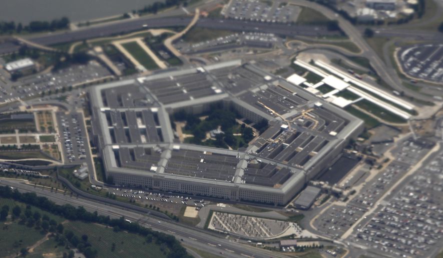 In this June 3, 2011, file photo, the Pentagon building is seen from air from Air Force One. The Pentagon is reportedly reviewing its information warfare operations after social media companies cracked down on a pro-American influence operation with potential ties to the U.S. government. (AP Photo/Charles Dharapak, File)  **FILE**