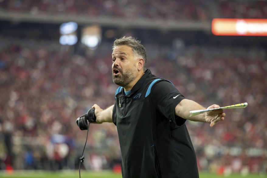 Head coach Matt Rhule of the Carolina Panthers coaches against the Arizona Cardinals in an NFL football game, Sunday, Nov. 14, 2021, in Glendale, Ariz. Panthers defeated the Cardinals 34-10. (AP Photo/Jeff Lewis)