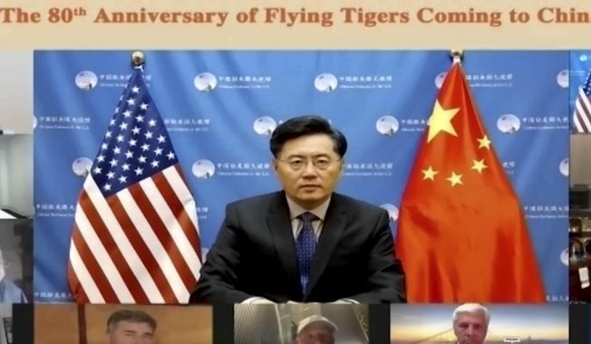 In this screenshot taken on Nov. 16, 2021, and released by Chinese People&#x27;s Association of Friendship with Foreign Countries, Qin Gang, China&#x27;s ambassador to the U.S. speaks during a video conference call on the 80th anniversary of Flying Tigers Coming to China event in Beijing, China. (Chinese People&#x27;s Association of Friendship with Foreign Countries via AP) ** FILE **