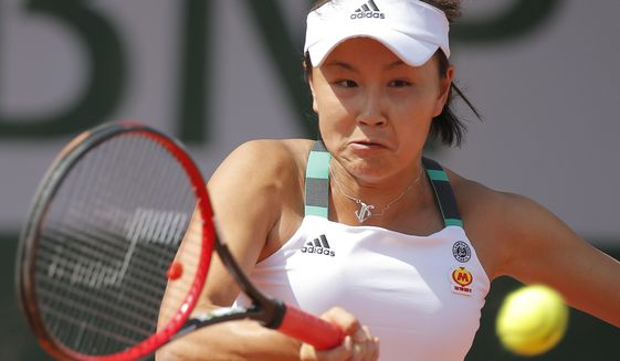 FILE - China&#39;s Shuai Peng plays a shot against Romania&#39;s Sorana Cirstea during their first round match of the French Open tennis tournament at the Roland Garros stadium, in Paris, France. Tuesday, May 30, 2017. Chinese authorities have squelched virtually all online discussion of sexual assault accusations apparently made by the Chinese professional tennis star against a former top government official, showing how sensitive the ruling Communist Party is to such charges. (AP Photo/Michel Euler, File)
