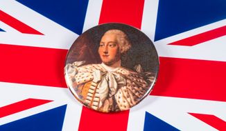 London, U.K. - Dec. 6th 2019: A pin badge with a portrait of King George III of the United Kingdom, pictured over the U.K. flag. (Image: Chris Dorney via Shutterstock) ** FILE **
