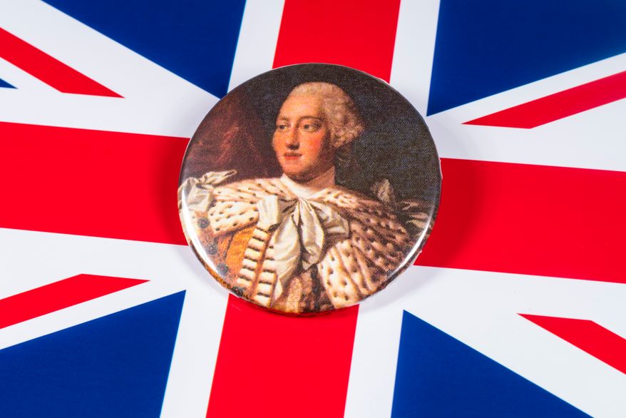 London, U.K. - Dec. 6th 2019: A pin badge with a portrait of King George III of the United Kingdom, pictured over the U.K. flag. (Image: Chris Dorney via Shutterstock) ** FILE **