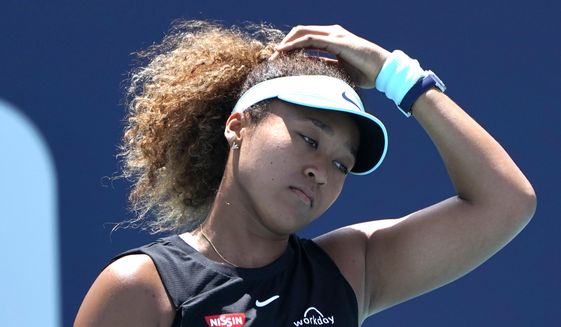 Naomi Osaka, of Japan, reacts during her match against Maria Sakkari, of Greece, in the quarterfinals of the Miami Open tennis tournament in Miami Gardens, Fla., on March 31, 2021. Osaka says she&#39;s been shocked to hear about a fellow player who has gone quiet since making a sexual assault allegation against a former top government official in China. (AP Photo/Lynne Sladky, File)