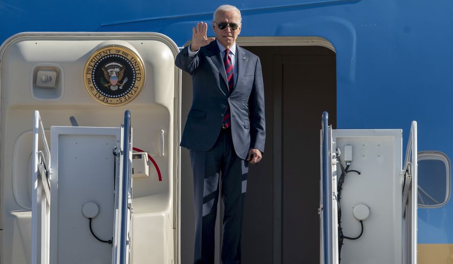 President Joe Biden waves as he boards Air Force One for a trip to New Hampshire to promote his economic agenda, Tuesday, Nov. 16, 2021, at Andrews Air Force Base, Md. (AP Photo/Gemunu Amarasinghe)