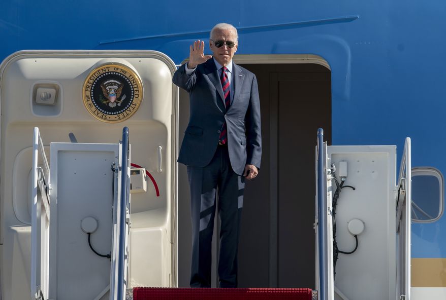 President Joe Biden waves as he boards Air Force One for a trip to New Hampshire to promote his economic agenda, Tuesday, Nov. 16, 2021, at Andrews Air Force Base, Md. (AP Photo/Gemunu Amarasinghe)