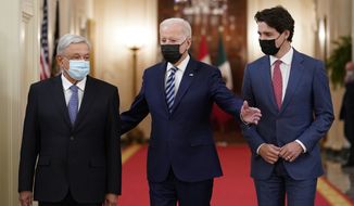 President Joe Biden, center, walks with Mexican President Andrés Manuel López Obrador, left, and Canadian Prime Minister Justin Trudeau, right, to a meeting in the East Room of the White House in Washington, Thursday, Nov. 18, 2021. Expanding the U.S.-Canada-Mexico economic relationship in the face of a looming global recession is a central focus of President Biden&#x27;s meeting Monday, Jan. 9 with his Mexican and Canadian counterparts — a summit of three leaders overseeing the world&#x27;s single most powerful free trade alliance. (AP Photo/Susan Walsh)