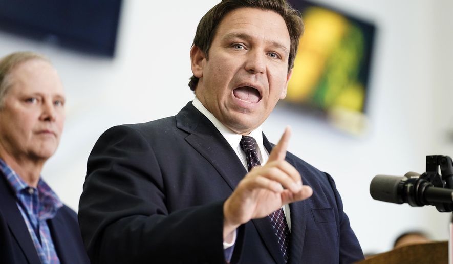 Florida Gov. Ron DeSantis speaks to supporters and members of the media after a bill signing Thursday, Nov. 18, 2021, in Brandon, Fla. DeSantis signed a bill that protects employees and their families from coronavirus vaccine and mask mandates. (AP Photo/Chris O&#39;Meara)